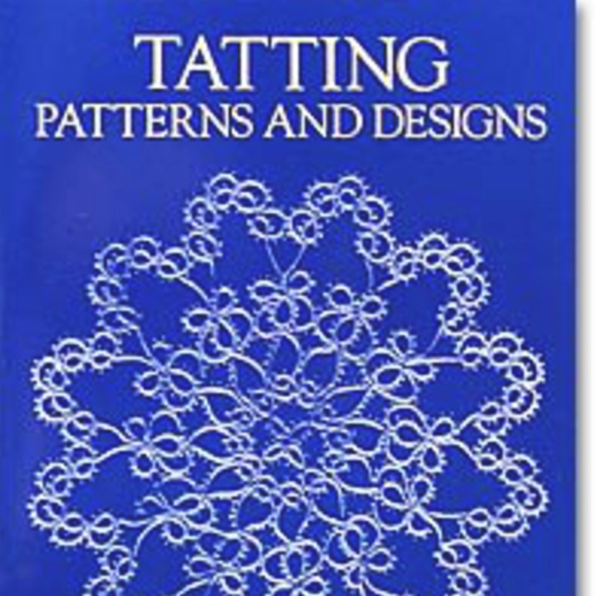 Cover of the book "Tatting Patterns and Designs" by Handy Hands, showcasing an elaborate white lace design on a blue background. The prominent white title at the top encourages beginning tatters to delve into beautiful patterns.