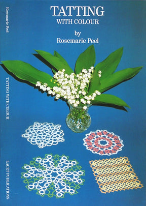 A book cover titled "Tatting With Colour" by Rosemarie Peel features a vase with lily of the valley flowers and four different colorful tatting patterns laid out on a blue surface. The book spine reads "Tatting With Colour" by Handy Hands.