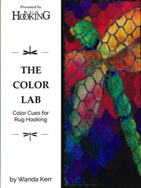 The image showcases the cover of the book titled "The Color Lab - Color Cues for Rug Hooking" by Wanda Kerr, published by Ampry Publishing. It features a colorful abstract design with vibrant and subdued hues, resembling interconnected shapes. At the top, it reads "Presented by Rug Hooking," emphasizing color transitions within the artwork.