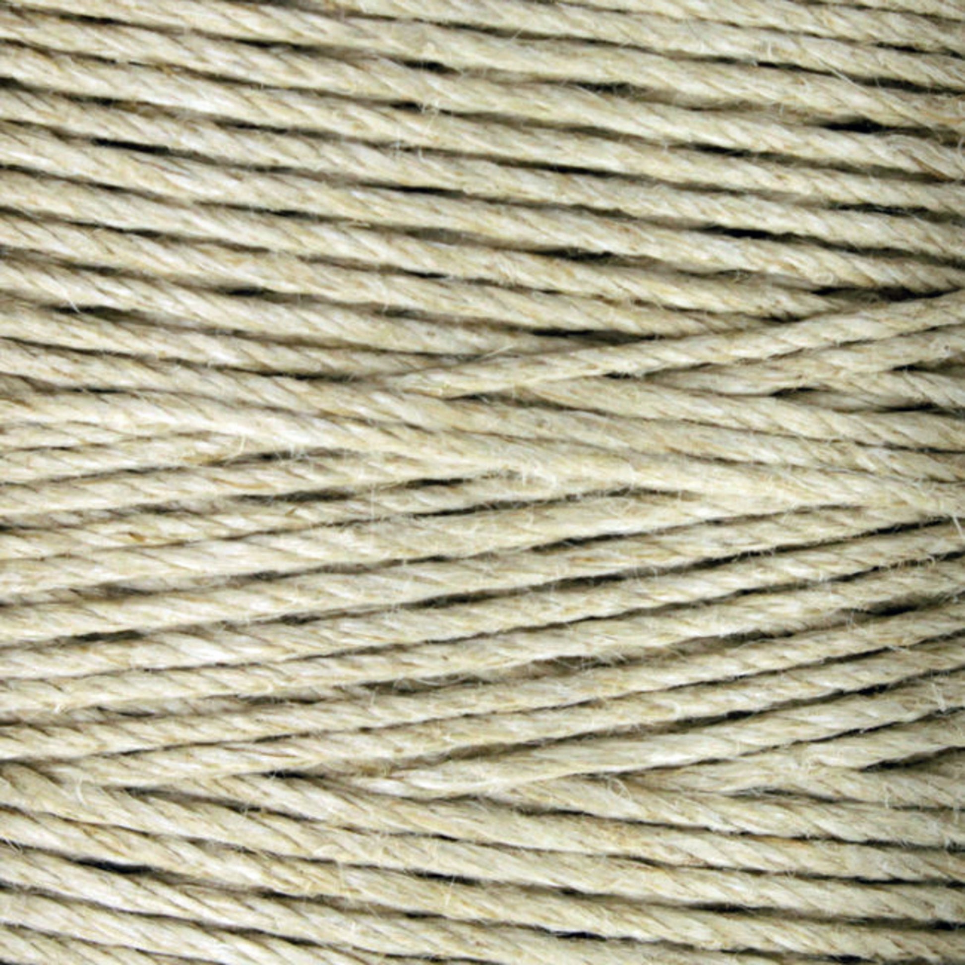 Close-up image of Soft Finish Linen Warps by Stuart C. Hurlbert & Co., showcasing beige twine wound in tight, parallel loops with a coarse, fibrous texture reminiscent of traditional tapestry weaving.