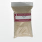 A clear plastic bag labeled "G & K Craft, Sodium Alginate Thickener, 8 oz." contains a light brown granular substance derived from seaweed. The bag has a red label with handling precautions.