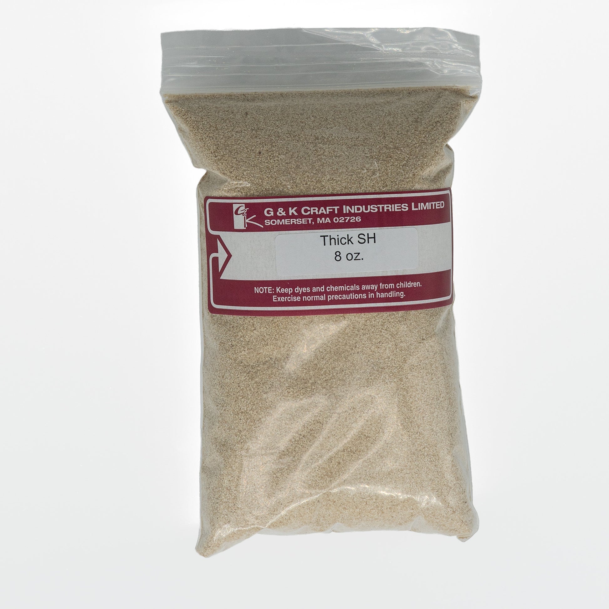 A clear plastic bag labeled "G & K Craft, Sodium Alginate Thickener, 8 oz." contains a light brown granular substance derived from seaweed. The bag has a red label with handling precautions.