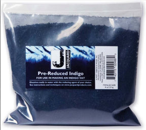 A sealed clear plastic bag labeled "G & K Craft Pre-Reduced Indigo" for use in indigo dyeing. The bag contains a dark blue powder, ready to create your dye vat. The label, featuring easy-to-use directions and a barcode, ensures a hassle-free dyeing process.