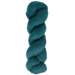 A neatly twisted skein of Cascade Heritage Sock Yarn, made from superwash merino wool in a teal shade, set against a white background.