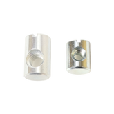 Two Schacht Replacement Barrel Nuts (from a 5-pack) by Schacht Spindle Co. are shown against a white background. The metallic cylindrical nuts have slotted tops and threaded holes. The nut on the left is larger in both height and diameter compared to the smaller nut on the right.