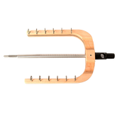 The Schacht Spinning Wheel Flyer Assembly by Schacht Spindle Co. features a wooden and metal frame with multiple pegs and a central rod, designed to support or hold items, likely serving as a specialized tool or instrument holder. Predominantly crafted from wood, it incorporates exceptional metal components for enhanced support and functionality.