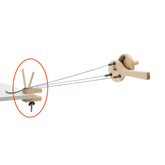 The Schacht Incredible Rope Machine Separator Kit by Schacht Spindle Co. features a wooden mechanical apparatus with gears and strings, highlighted by a red circle around a specific part of the device. The strings are connected to a central arm and are held in place by wooden pegs, indicating a point of interest or instruction.