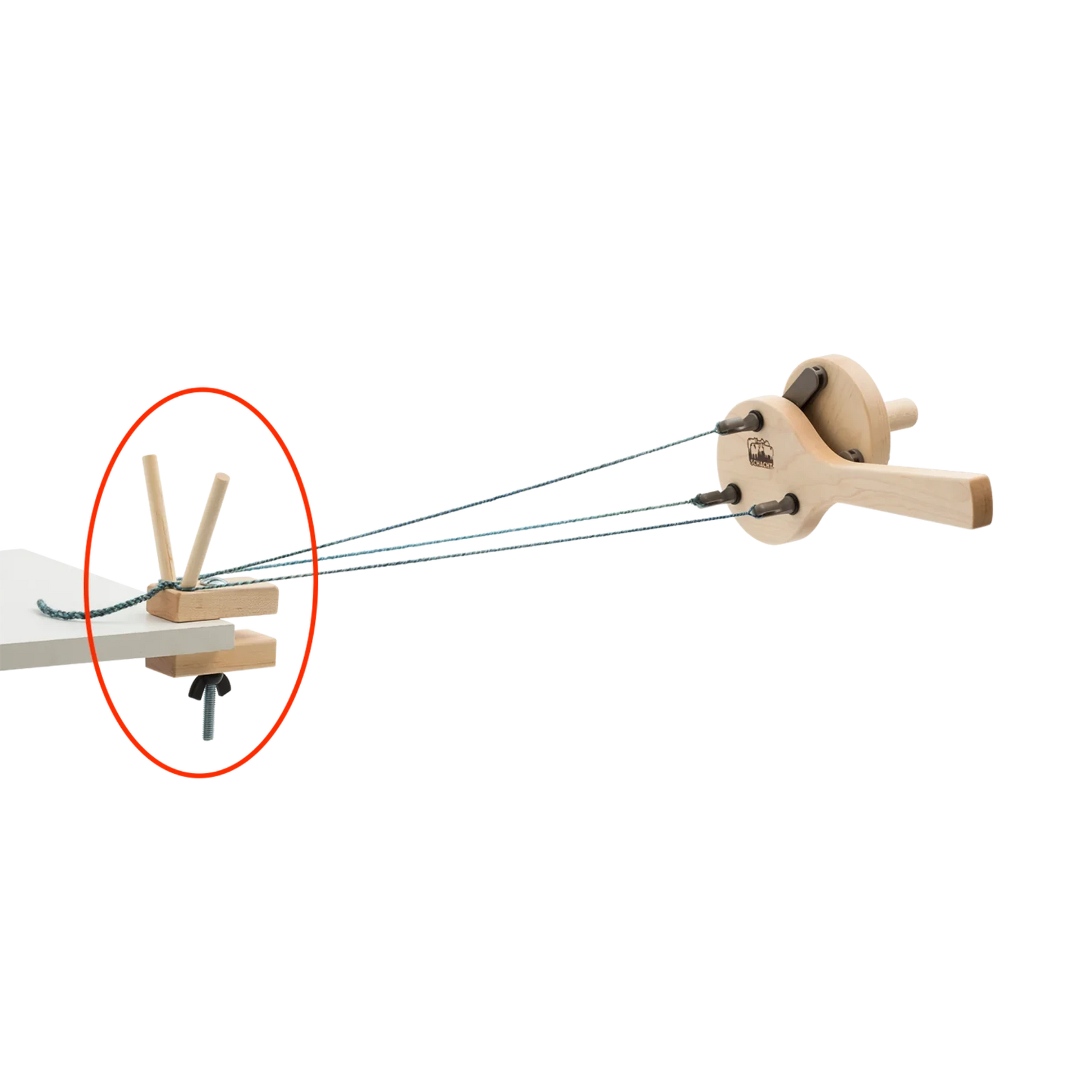 The Schacht Incredible Rope Machine Separator Kit by Schacht Spindle Co. features a wooden mechanical apparatus with gears and strings, highlighted by a red circle around a specific part of the device. The strings are connected to a central arm and are held in place by wooden pegs, indicating a point of interest or instruction.