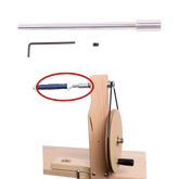 The Schacht Single End Hand Winder Shaft Kit from Schacht Spindle Co. is a manual yarn winder featuring a wooden base and metal components, which include a yarn guide positioned next to a silver rod, a set screw, and a small hex wrench. The winder is operated using a circular wheel and handle. Additionally, the image highlights one specific part in red.