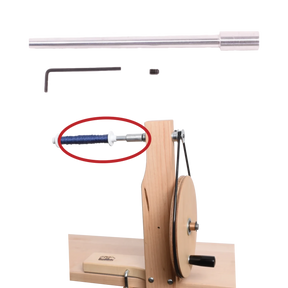 The Schacht Single End Hand Winder Shaft Kit from Schacht Spindle Co. is a manual yarn winder featuring a wooden base and metal components, which include a yarn guide positioned next to a silver rod, a set screw, and a small hex wrench. The winder is operated using a circular wheel and handle. Additionally, the image highlights one specific part in red.