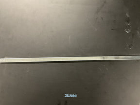 A black surface with a horizontal metallic rod in the middle. The word "Louët Metal shaft bar W/Kombo/MD" is faintly visible in blue lowercase letters near the bottom center of the image, almost as if it were lost in storage.