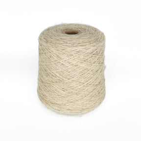 A large cone of Bartlett Maine Wool, Sport Weight by Bartlettyarns is neatly wound, standing upright against a white background. Its texture features a homespun appearance with visible fibrous, natural details.