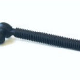 An image of a Louët Brake Tension Bolt from Louët Inc. features a black plastic construction with a round head and ribbed shaft. One side of the head has a wing-like extension, suggesting it might be used as a thumb screw or hand-tightened fastener. This replacement tension bolt is set against a plain white background and is designed specifically for use with Louët wheels.