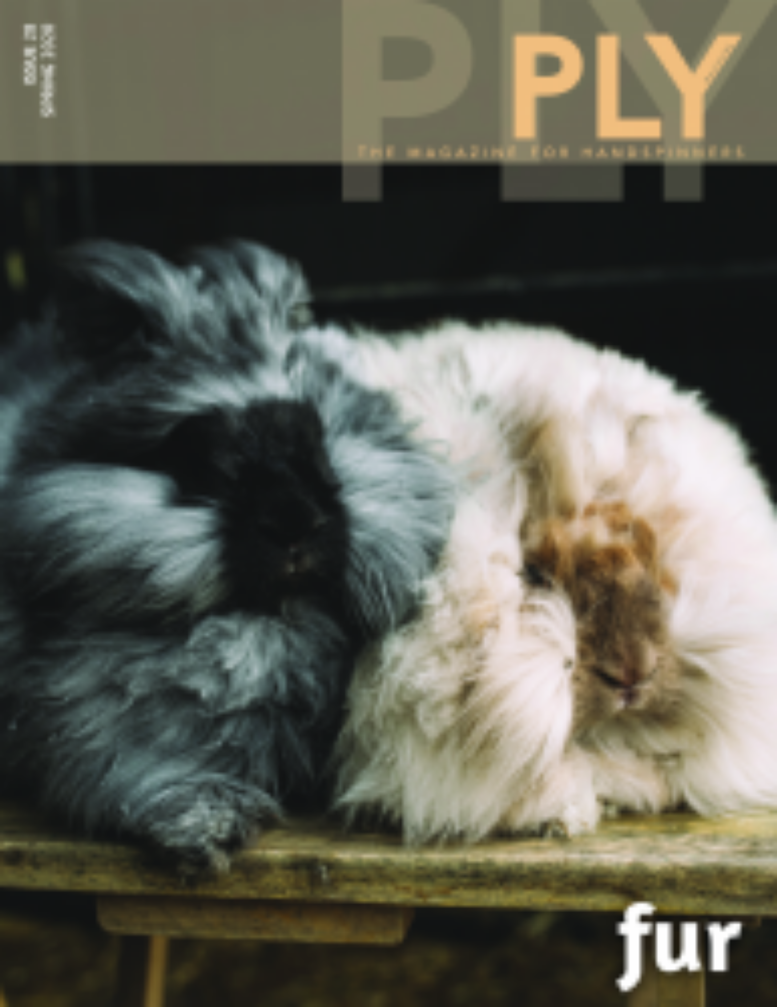 Cover of PLY - The Magazine for Handspinners, Issue 28, Spring 2020: Fur by PLY Magazine, featuring two fluffy rabbits – one black and grey, the other white and beige – cuddled together on a wooden surface. The magazine title "PLY: The Magazine for Handspinners" adorns the top, with "fur" at the bottom. Issue and date details are located in the upper left corner. A curious rabbit peeks from behind.