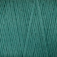 A close-up of Cotton Carpet Warp 8/4 in teal reveals tightly woven, smooth cotton strands with fibrous details and uniform texture, ideal for vibrant rag rugs.