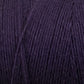 Close-up of dark purple Cotton Carpet Warp 8/4, featuring fine, tightly wound fibers. The soft and smooth texture highlights the intricate details of the colorfast material.