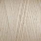 Close-up of cream-colored Cotton Carpet Warp 8/4 showing tightly wound, interwoven threads with a soft, slightly fuzzy texture. Tiny specks are visible on the smooth background, suggesting its potential for colorfast rag rugs.