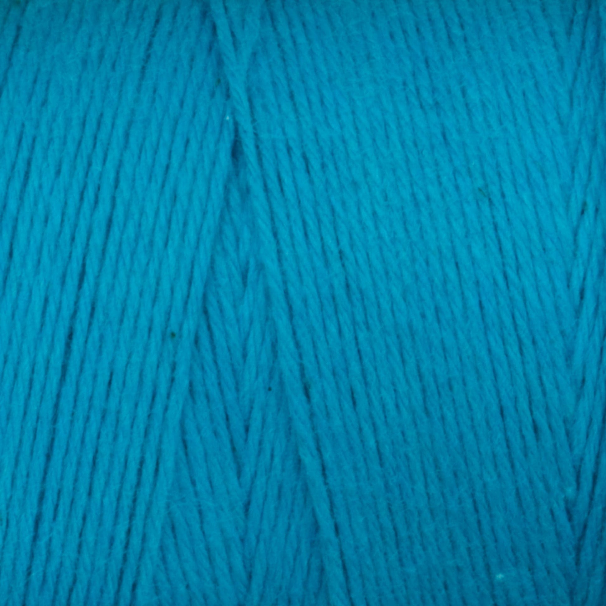 Close-up image of Cotton Carpet Warp 8/4 in bright turquoise, tightly wound in a neat bundle. The smooth and consistent texture with visible strands highlights its fibrous quality, making it ideal for crafting durable rag rugs.