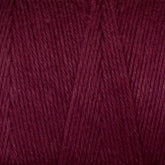 Close-up of Cotton Carpet Warp 8/4 yarn, revealing tightly woven fibers with a smooth texture. Its rich burgundy hue highlights the warmth and cozy feel, typical of this durable cotton warp yarn known for colorfastness.