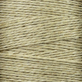 Close-up of tightly wound Soft Finish Linen Warps, highlighting its coarse texture and fibrous strands. Resembling natural linen warps used in tapestry weaving, this thick twine is perfect for crafting or packaging.