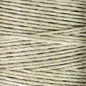 A close-up of Soft Finish Linen Warps shows tightly wound, beige twine with a coarse, fibrous texture. Individual strands twist together to create a consistent pattern across the image.