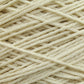 Close-up view of Jagger Brothers, Inc. Worsted Wool Warps intertwined and forming a soft, textured pattern reminiscent of traditional Navajo designs. The image highlights the fibrous details and the natural, creamy color of the yarn material.