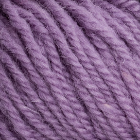 Close-up of thick, twisted Halcyon Deco Rug Wool in a lavender hue by Caledonian Dye Works, highlighting the texture and fibers of the 100% wool material.