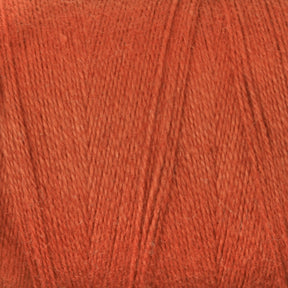 A close-up of a skein of Maurice Brassard 8/2 Cottolin Organic Yarn. The texture of the yarn is visible, showcasing its fine, soft, and slightly fuzzy threads. The yarn appears to be tightly wound, making it ideal for crafting items like the Cottolin Tea Towel Kit or projects using a four shaft loom.