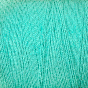 A close-up image of light turquoise yarn from Maurice Brassard, showcasing the texture and strands of the woven fibers. The 8/2 Cottolin Organic Yarn from the Cottolin Tea Towel Kit appears soft and is uniformly colored throughout.