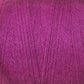 A close-up image of a tightly wound ball of magenta-colored 8/2 Cottolin Organic Yarn from Maurice Brassard. The texture is detailed, showing the individual fibers and the even, consistent twist of the threads—a perfect addition to a Cottolin Tea Towel Kit for those working on a four shaft loom.