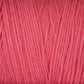 A close-up view of soft, unmercerized Maurice Brassard Cotton 8/8 Carpet Warp in a vibrant pink color. The fibers are neatly aligned, showcasing the texture and smoothness perfect for knitting and crochet projects.