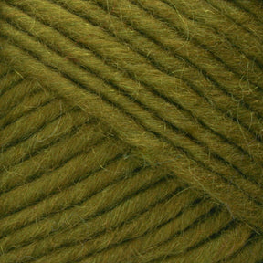 Close-up view of Lamb's Pride Bulky Yarn by Brown Sheep, showcasing its soft, fuzzy texture. The fibers are neatly woven, creating a diagonal pattern across the image. The green color has slight variations, adding depth to the yarn’s appearance—perfect for knitters and crocheters planning projects like cozy woven blankets.