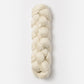 A neatly coiled hank of Blue Sky Fibers Metalico sport weight yarn is displayed against a plain white background. The off-white yarn from Blue Sky Fibers is tightly braided, showcasing its smooth texture and uniform thickness.