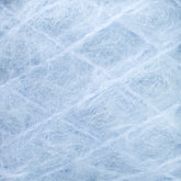 Close-up of a light blue, fuzzy textile material made from the luxurious Victorian Brushed Mohair Yarn by Caledonian Dye Works. The fibers are thin and intertwined, creating a soft, airy texture. The pattern appears random with thin, wispy threads crossing over each other, resulting in an overall effect that is both delicate and fluffy.