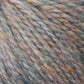 Close-up image of multicolored Peace Fleece Yarn by Harrisville Designs, highlighting grey, orange, blue, and purple threads with a soft and fuzzy texture. The wool and mohair blend fibers are intertwined, creating a thick and cozy appearance perfect for worsted weight knitting projects.