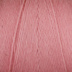 Close-up of a ball of Maurice Brassard's Medium Cotton 16/8 Mop Yarn in pink, showing the tightly wound strands with a slight sheen. The texture appears soft and smooth, suitable for knitting or crocheting projects. Made from sturdy cotton, the image highlights the detailed fibers and even color, perfect for both weaving and crafting endeavors.