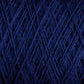 A close-up view of tightly wound dark blue Jagger Brothers, Inc. JaggerSpun Maine Line 3/8 Yarn | Mini-cone, showcasing its fibrous texture and the intricate overlapping strands. The color is deep and rich, creating a uniform and complex pattern of crisscrossing threads.