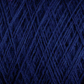 A close-up view of tightly wound dark blue Jagger Brothers, Inc. JaggerSpun Maine Line 3/8 Yarn | Mini-cone, showcasing its fibrous texture and the intricate overlapping strands. The color is deep and rich, creating a uniform and complex pattern of crisscrossing threads.