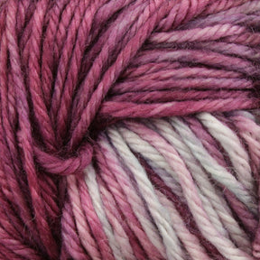 Close-up image of Malabrigo Rios, a variegated superwash yarn from Malabrigo Yarn, in shades of pink, purple, and cream. The fibers are twisted together, showcasing the texture and kettle-dyed color variations in the material.