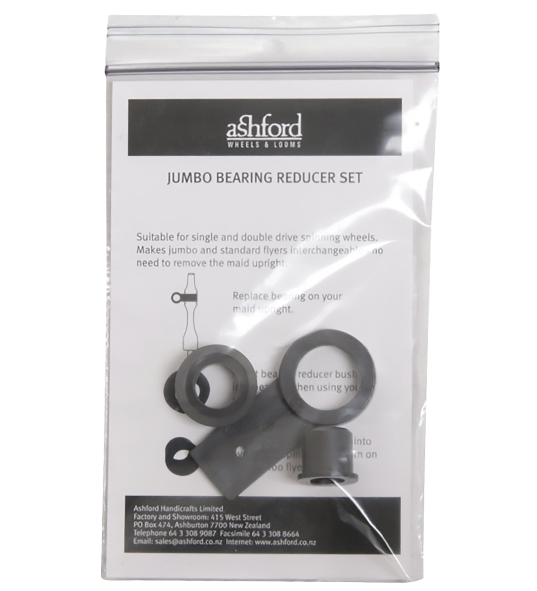 A clear plastic ziplock bag contains a document with text and a small illustrated diagram, labeled "Ashford Jumbo Flyer Bearing Reducer Set" by Ashford Handicrafts Limited. Also inside are several black plastic components. The bag is sealed, allowing the contents to be clearly visible.