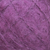 Close-up view of a ball of luxurious Victorian Brushed Mohair Yarn | Mini Skein from Caledonian Dye Works, showcasing its fuzzy texture with intricate loops and fibers.