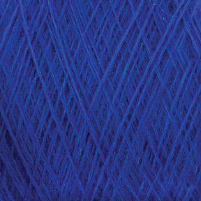 A close-up view of a tightly wound ball of Jagger Brothers, Inc.'s JaggerSpun Maine Line 3/8 Yarn | Large Cone, showcasing intricate layers and textures of the fibers and strands. The worsted spun yarns appear soft and boast a consistent shade of deep blue.