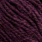 Close-up image of dark purple Harrisville Highland - Cones yarn by Harrisville Designs. The fibers are tightly twisted, exhibiting a slightly fuzzy texture. The various shades of purple create a rich, multidimensional appearance, further enhanced by the hint of spinning oils still present in this unscoured yarn.