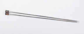 The Nova Platina Single Point Knitting Needles by Accessories Unlimited, featuring pointed ends and sleek wooden handles, lay parallel to each other on a plain white background.