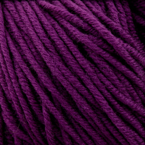 A close-up image of Plymouth Select Worsted Merino Superwash yarn from Plymouth Yarn Co. The deep purple fibers are tightly twisted and closely packed together, showcasing the texture and intricate patterns of the strands. This superwash yarn offers excellent stitch definition, appearing soft and perfect for knitting or crocheting projects.