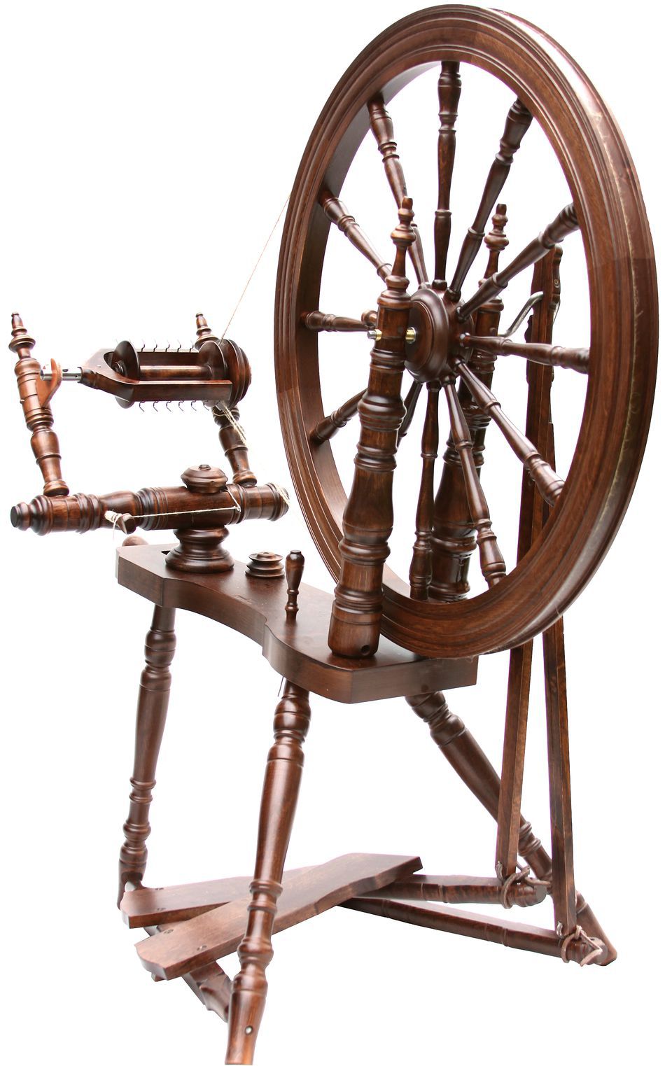 The Kromski Symphony Spinning Wheel by Kromski North America features a wooden spinning wheel with a large wheel connected to smaller components and a foot pedal, used for spinning fibers into thread or yarn. The Saxony-style design boasts turned legs and intricate woodwork, reminiscent of its elegant craftsmanship.