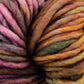 Close-up image of variegated Malabrigo Mecha yarn by Malabrigo Yarn, featuring strands in a diverse mix of colors including shades of pink, purple, green, and orange. The kettle dyed yarn appears soft and thick, ideal for knitting or crocheting purposes.