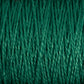 Close-up image of green 10/2 Pearl Cotton Yarn | Mini-cone strands from Supreme Corp., tightly wound together, creating a textured, interwoven pattern that showcases the material's versatile nature and impressive colorfastness.