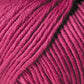 Close-up image of a ball of Jo Sharp Soho Summer DK Cotton by Kingfisher Yarn & Fibre in a rich magenta color. The yarn appears thick with individual strands tightly wound together, showcasing its texture and smoothness. The image highlights the lightweight cotton's detail and vibrant hue, perfect for summer knitting projects.