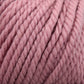 A close-up image of thick, super soft, Jo Sharp Silkroad Ultra yarn in a warm dusty rose hue from Kingfisher Yarn & Fibre. The tightly twisted fibers create a chunky, cuddly texture, making it ideal for cozy winter accessories or any knitting and crocheting projects that require bulky yarn.